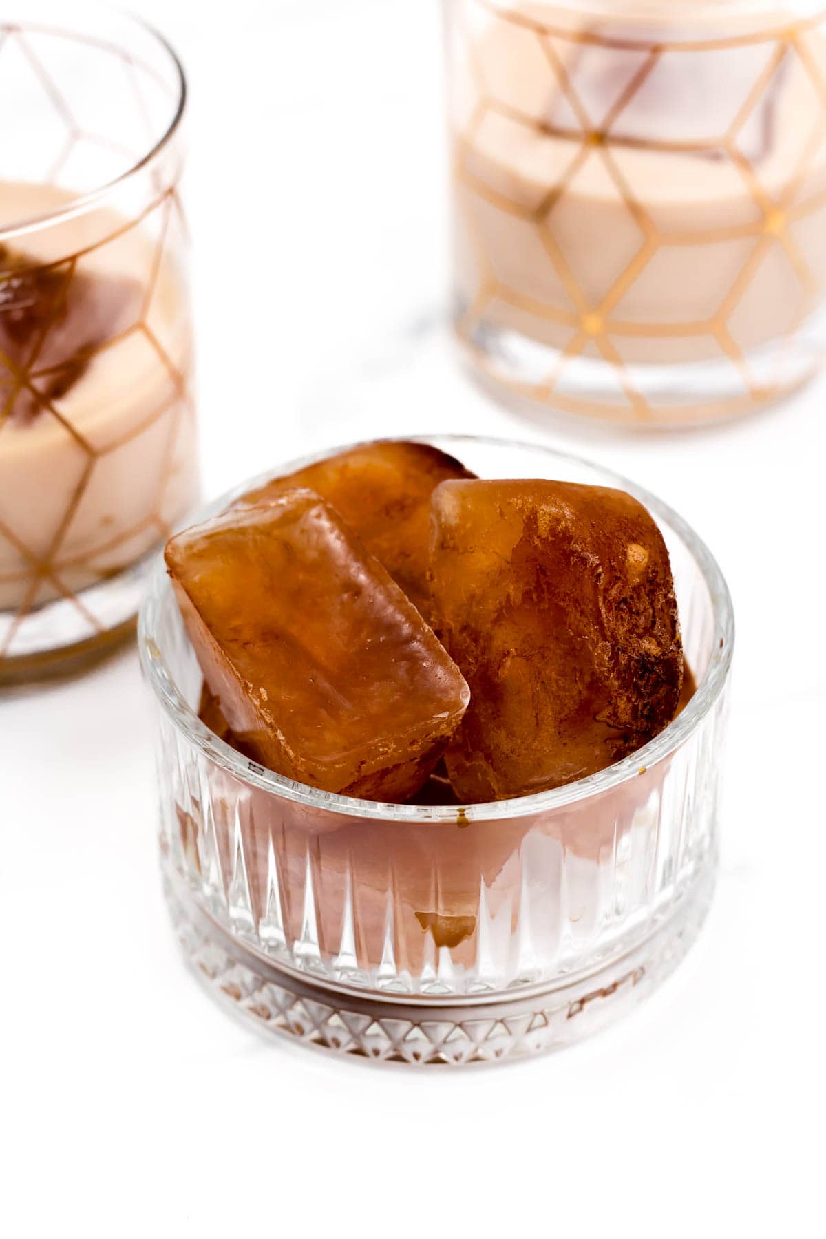 A glass bowl of coffee ice cubes.