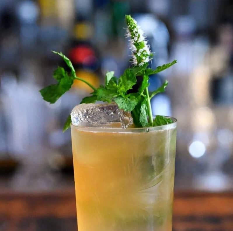 A light drink garnished with herbs.