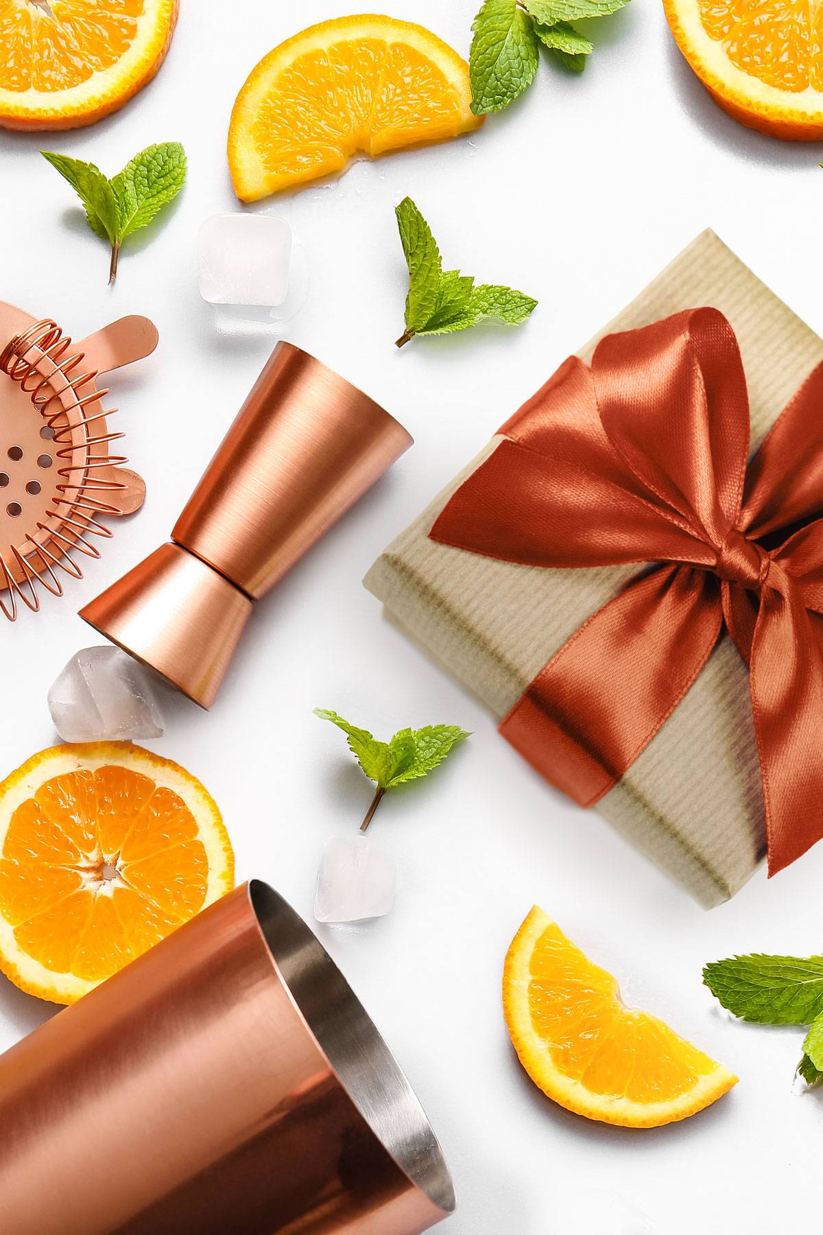 A wrapped package sits near copper bar tools.