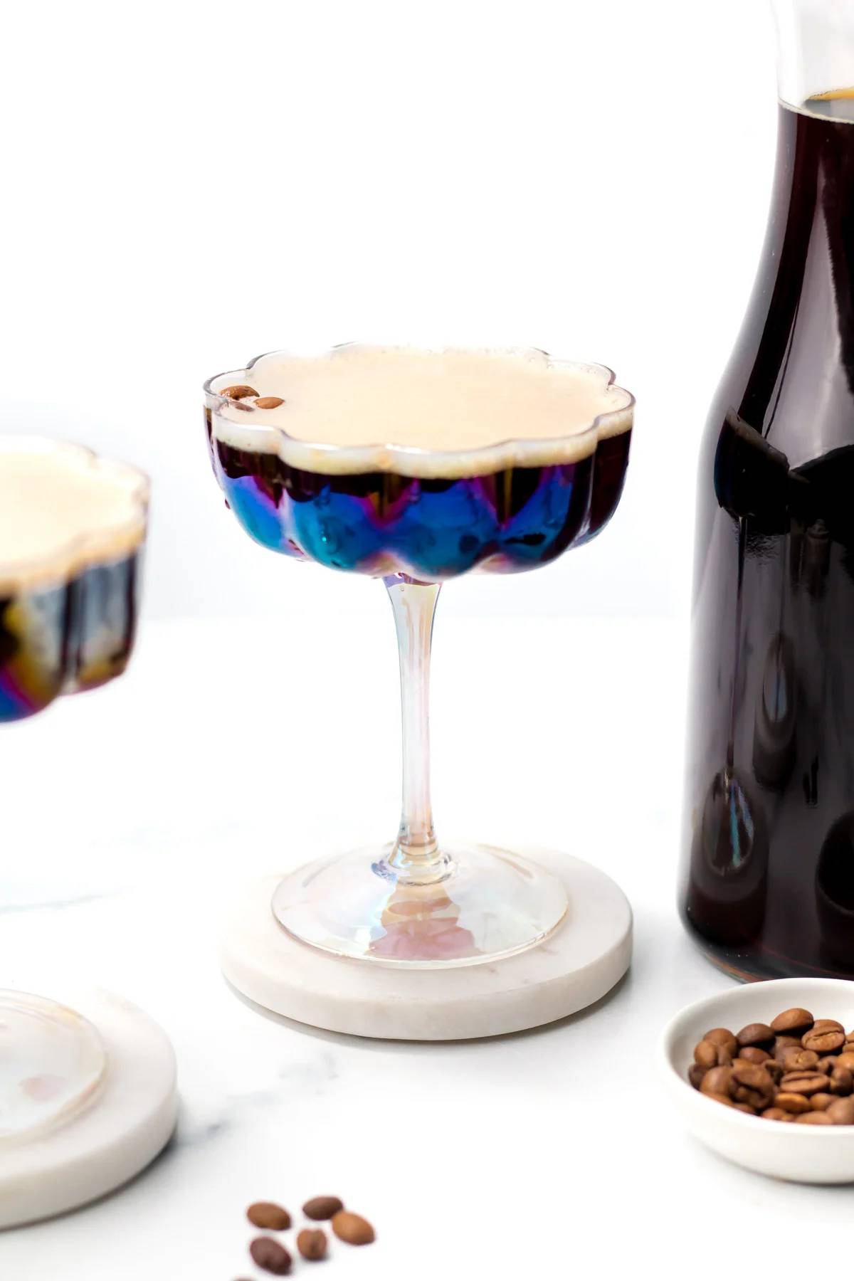 A stemmed glass holds an espresso martini.