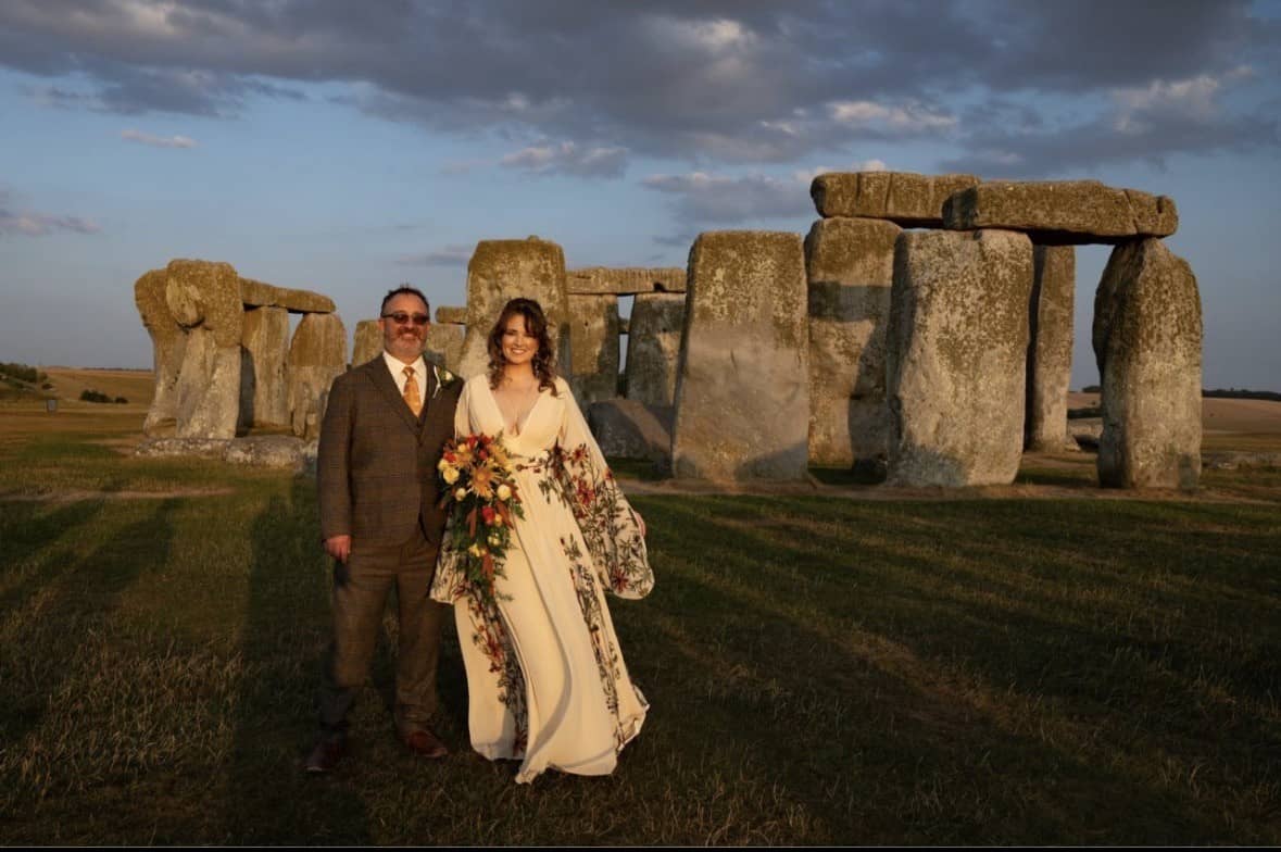 Wedding photo of man and woman at Stonehenge.