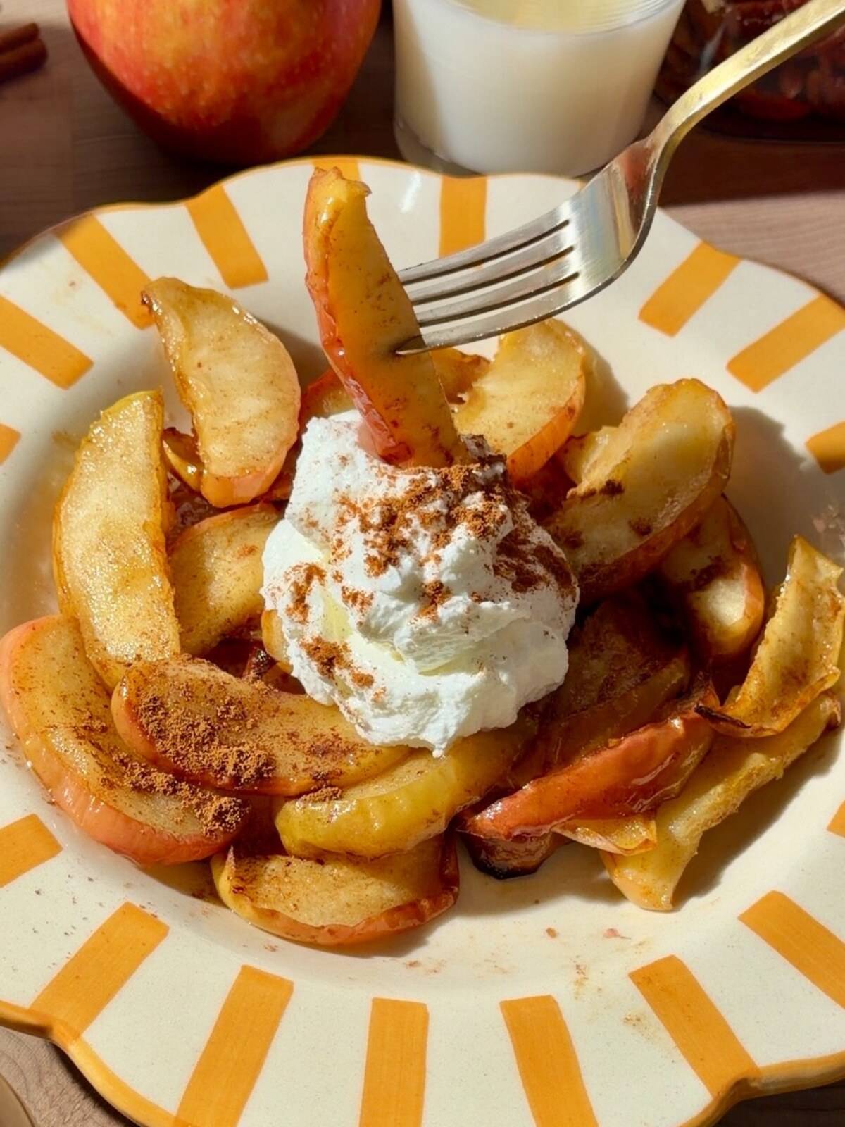 air fryer apples in a plate with greek yogurt