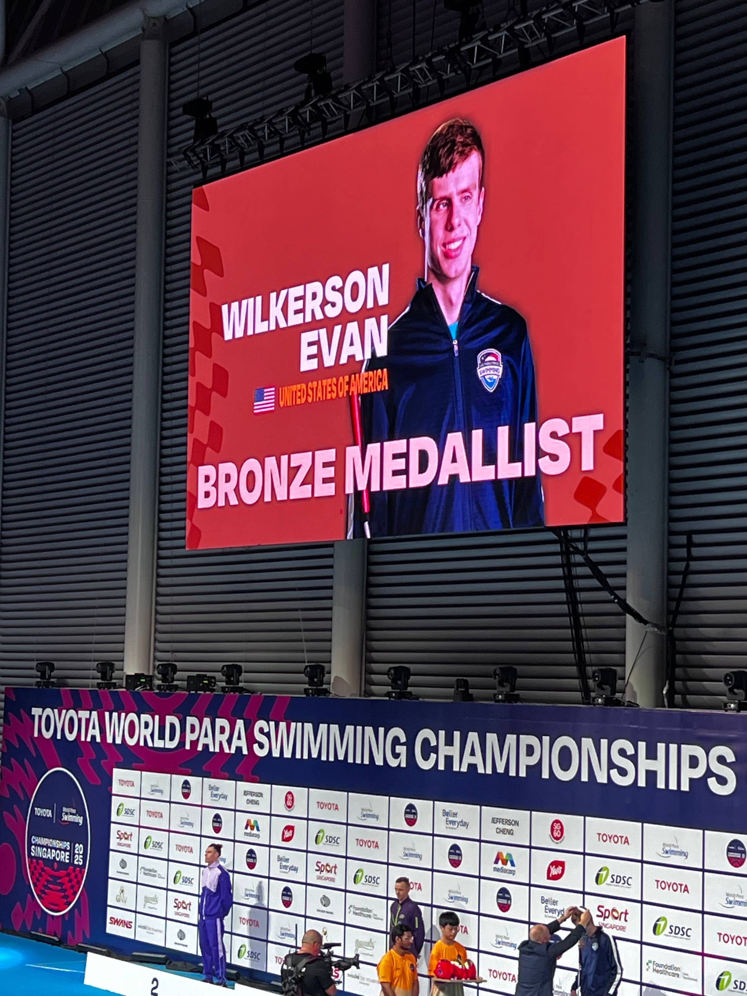 Evan Wilkerson's photo announcing him as the bronze medallist at the 2025 World Para Swimming Championships in Singapore.
