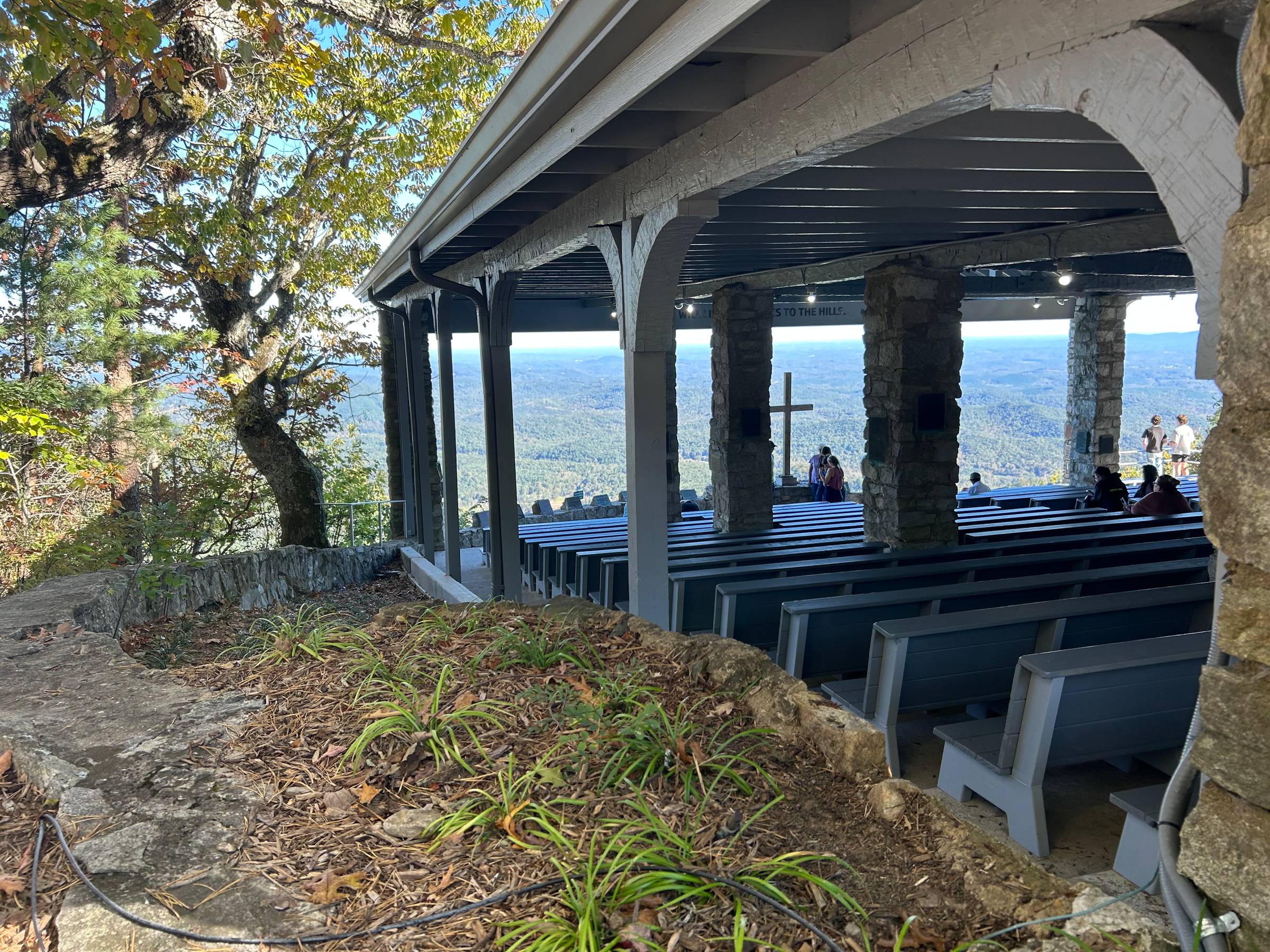 A photo of a rustic outdoor chapel looking out over the mountains of NW South Carolina.