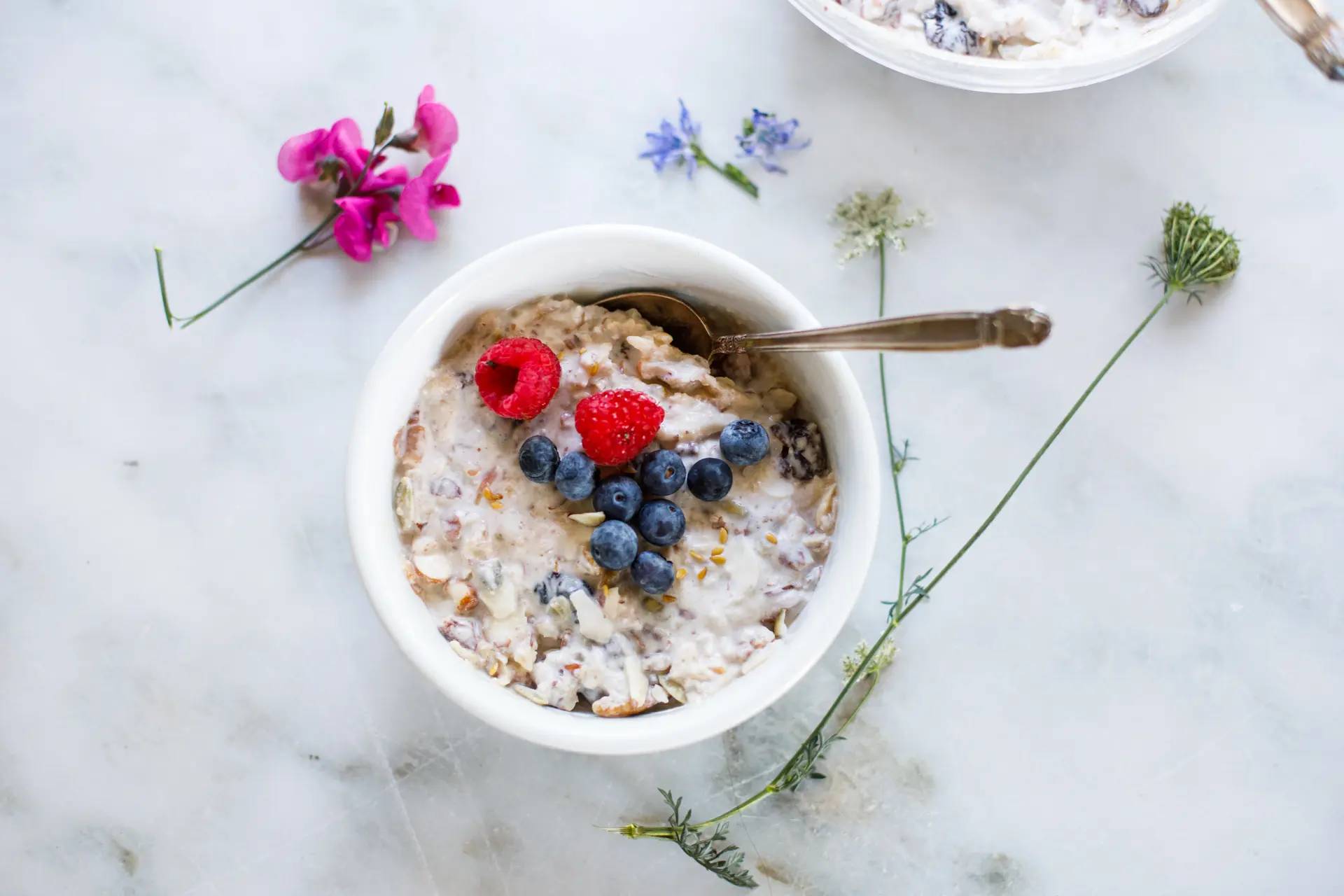 Bircher Muesli in a bowl with berries on top