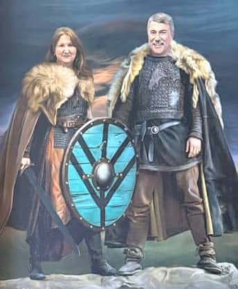 Caricature art of the author and her husband as vikings