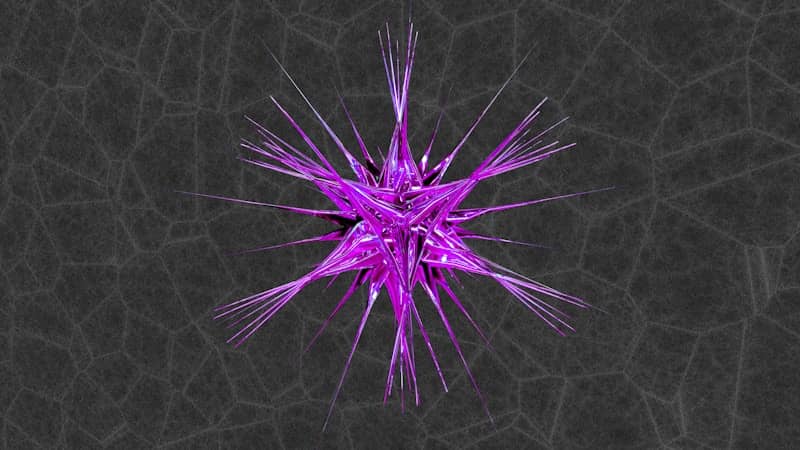 A purple, spiked crystal against a dark background.