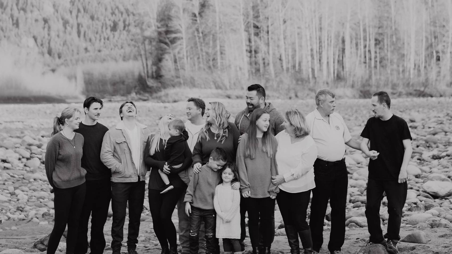 a large family gathering on the riverside