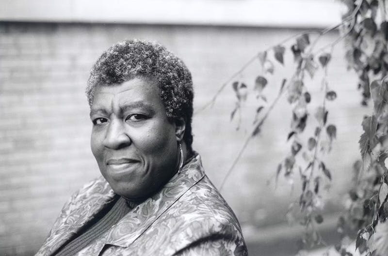 Octavia Butler with a slight smile