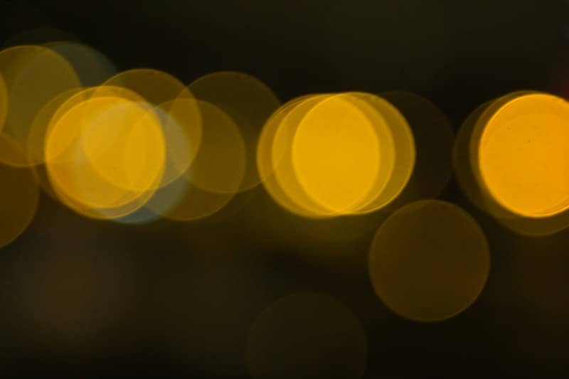 Blurred yellow circles of light at night