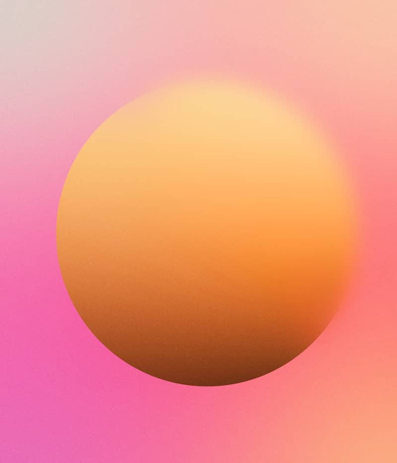 A pink and yellow background with a round object in the middle