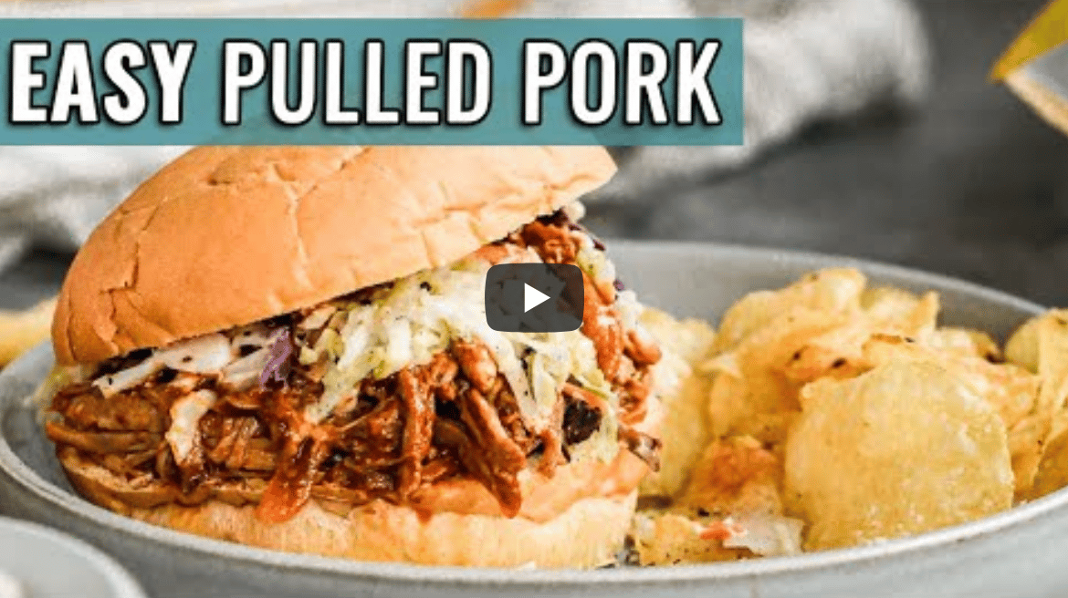 slow cooker pulled pork on a bun with potato chips