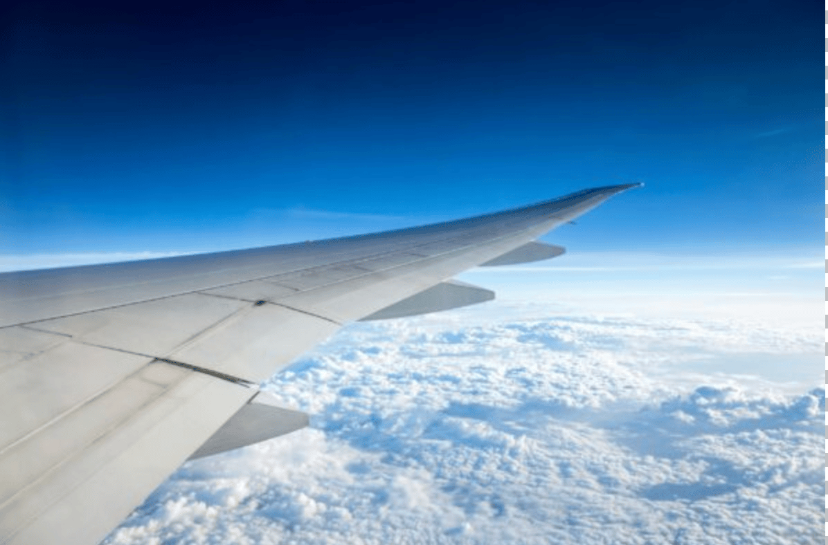 Plane soaring high above the clouds