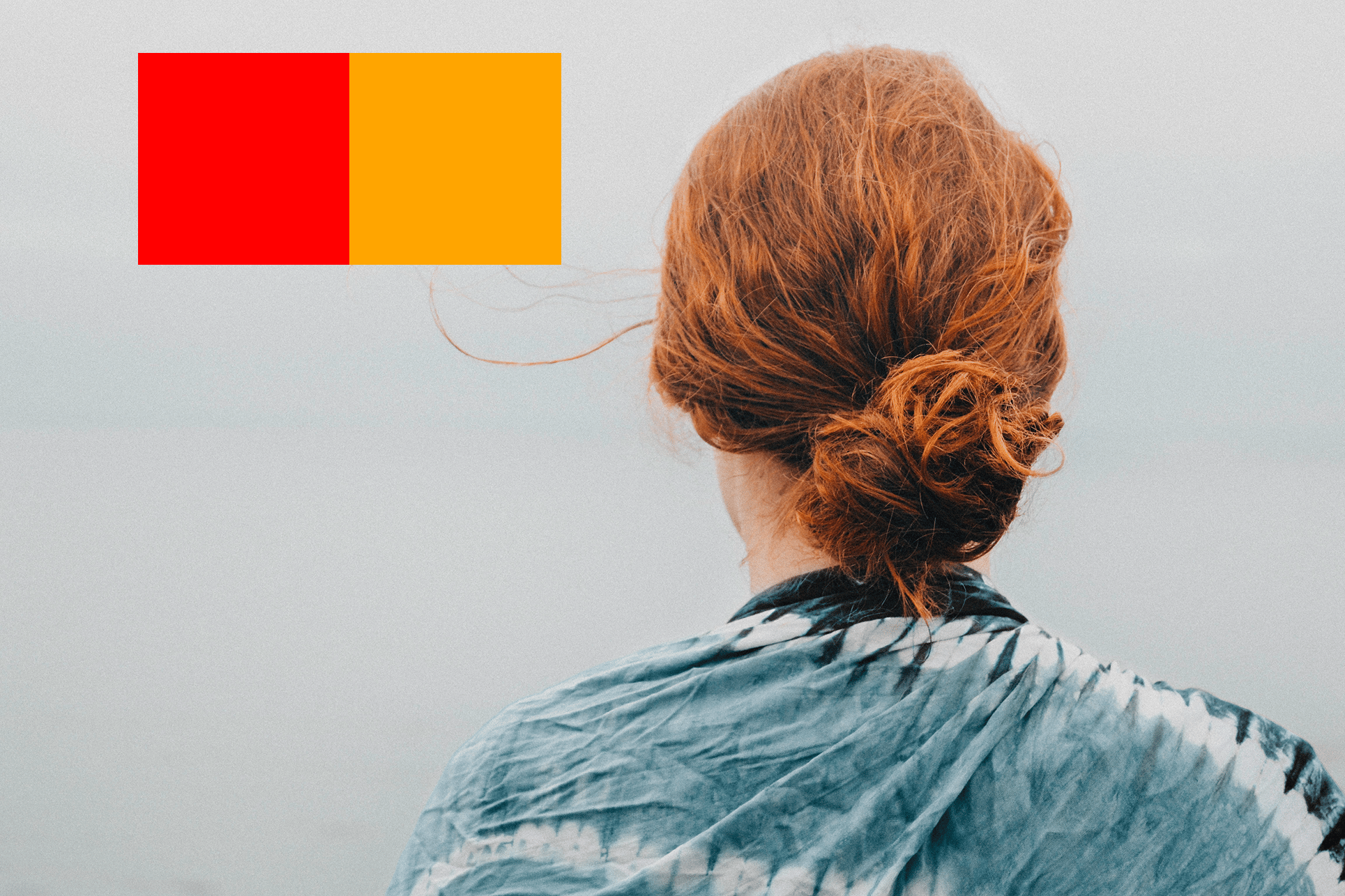 red hair person next to color blocks of red and orange