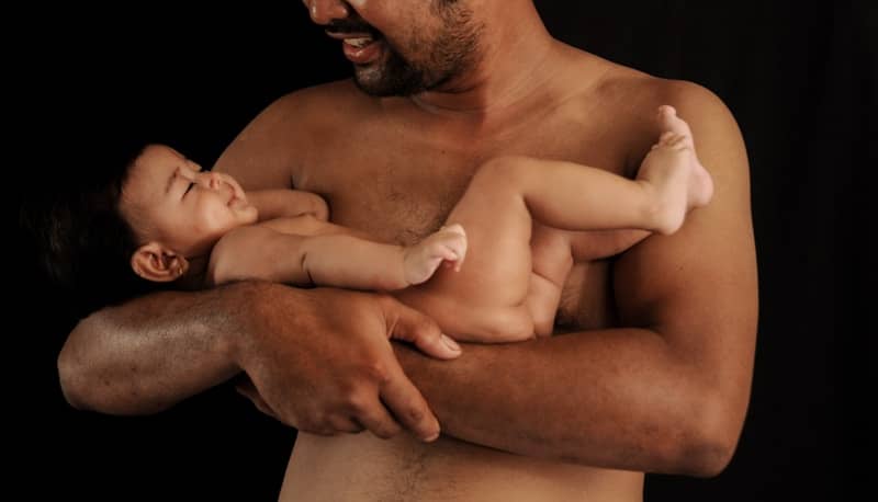 a man holding a baby