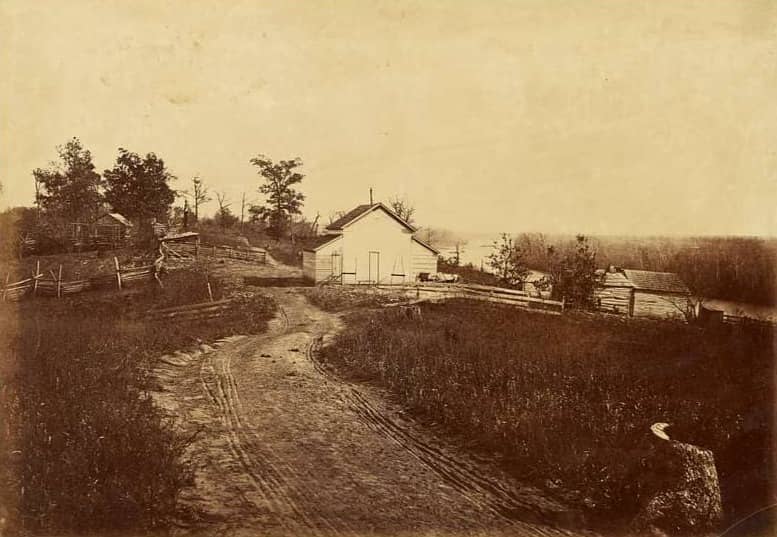 An 1867 photograph of a driveway leading to a barn.  