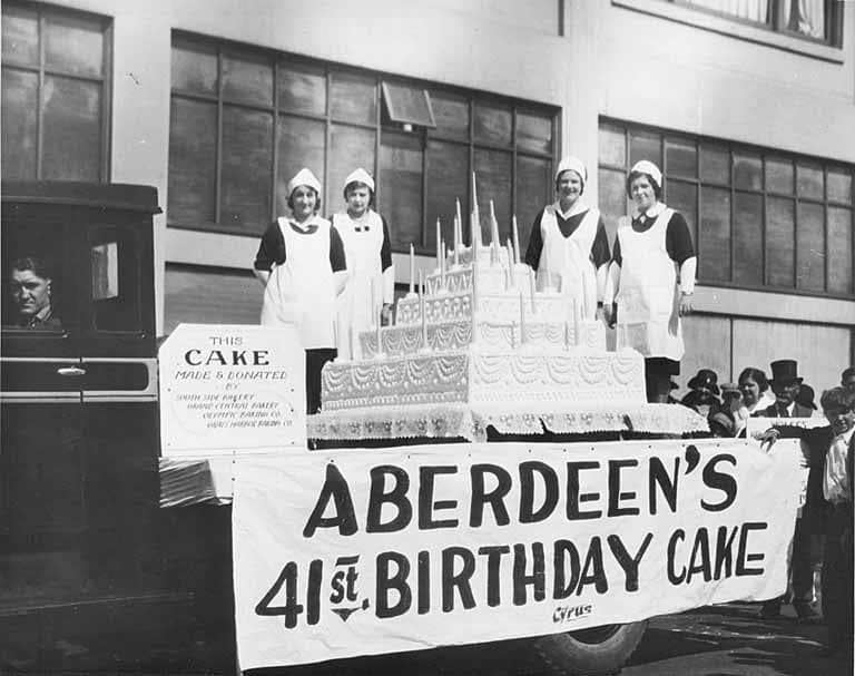 A picture of a 5-story cake in black and white reading "Aberdeen's 41st birthday cake"