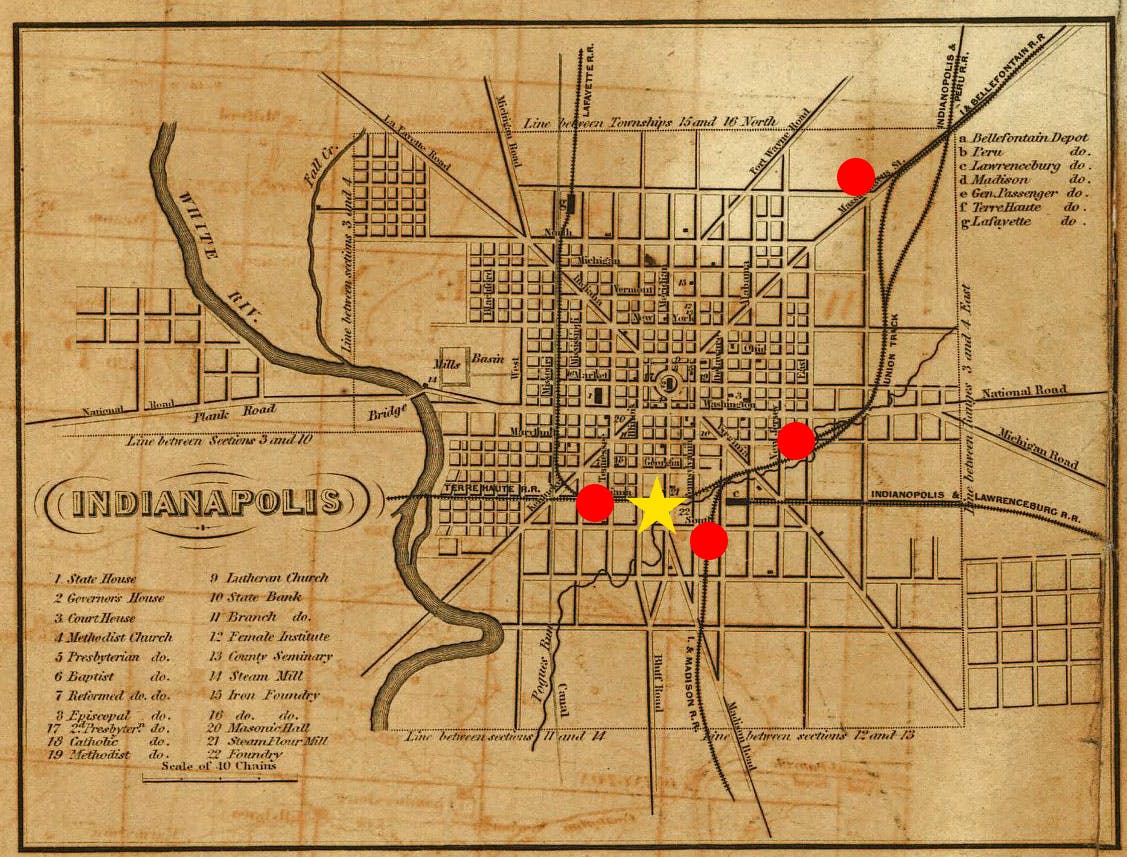 An 1852 railroad map of Indianapolis. Red circles note the original terminals of the four railroad companies that joined together to create the first Union Station. The site of the Union Station is noted as a yellow star. 