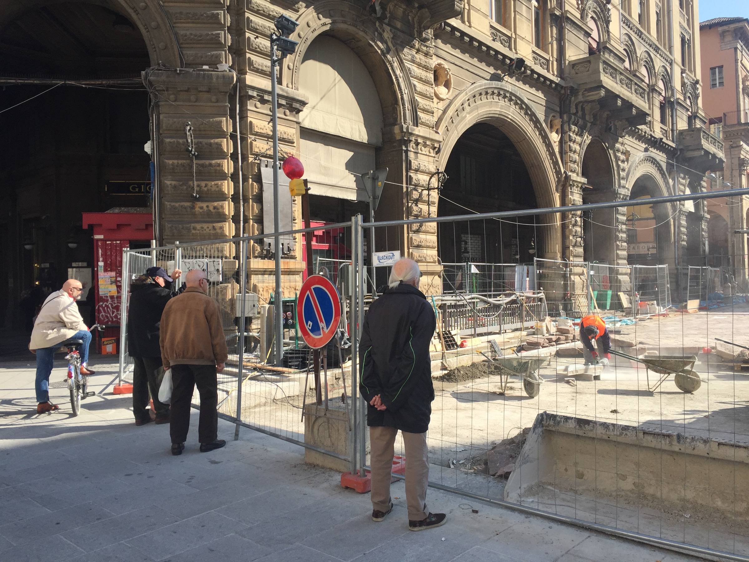 Picture of older Italian men overseeing construction sites. 