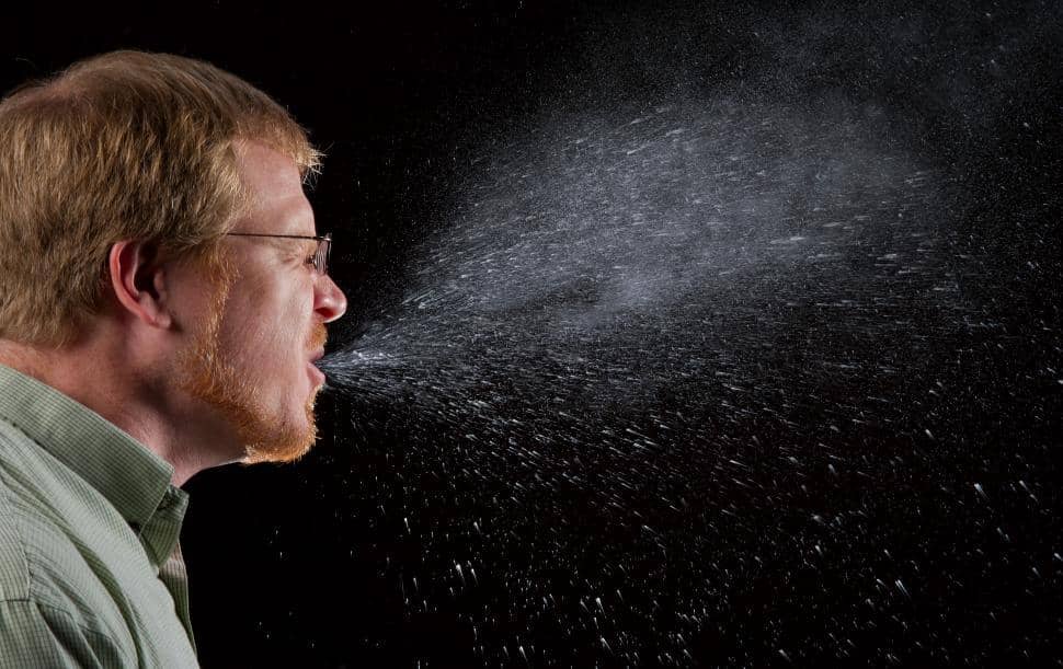 man sneezing