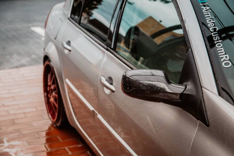 white vehicle close-up photography showing side mirror