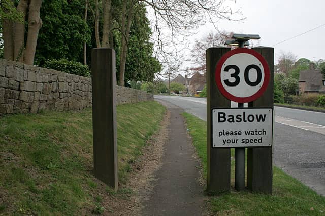 Speed limit sign showing 30, Baslow, please watch your speed. 