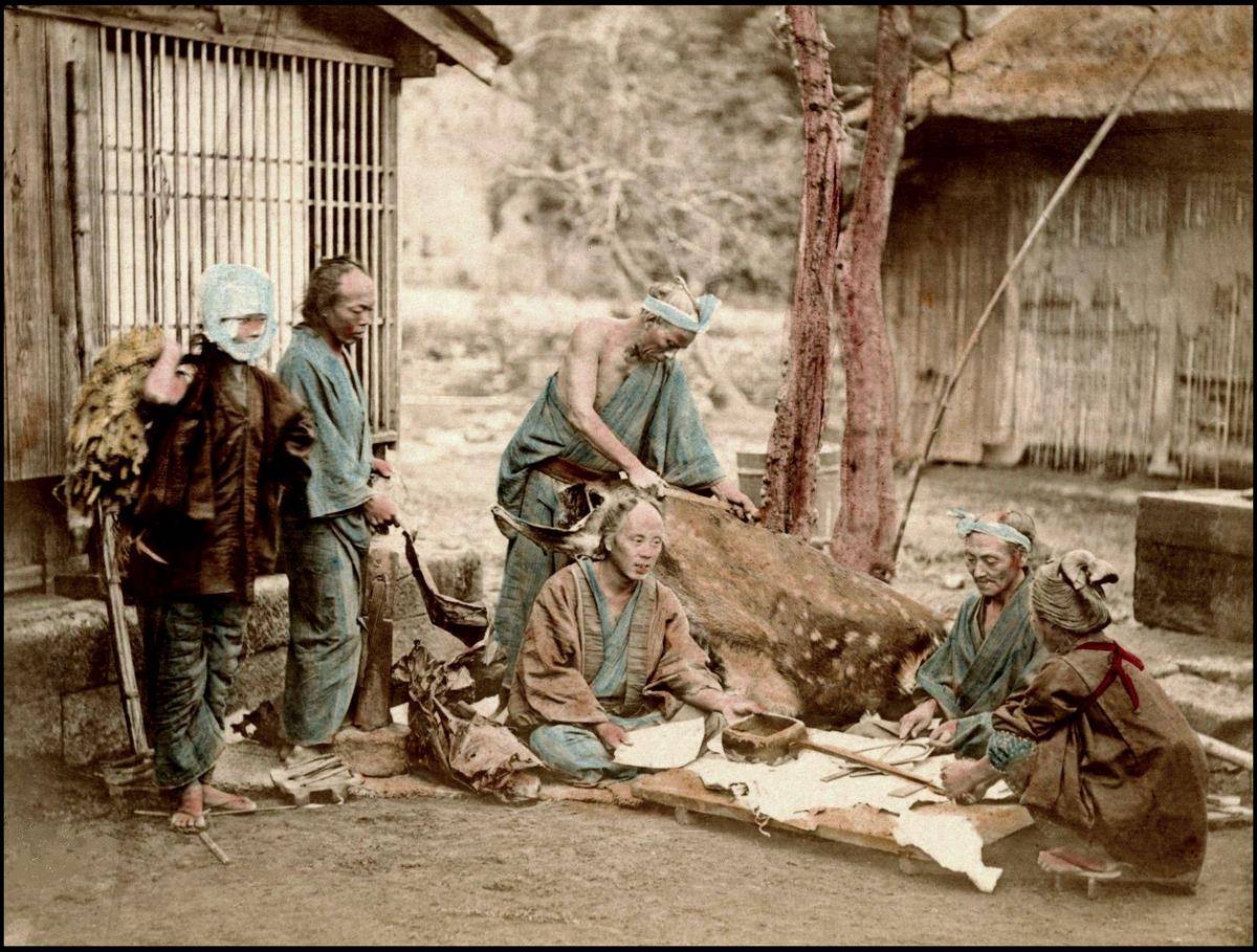 An 1873 staged photograph depicting burakumin leather workers.
