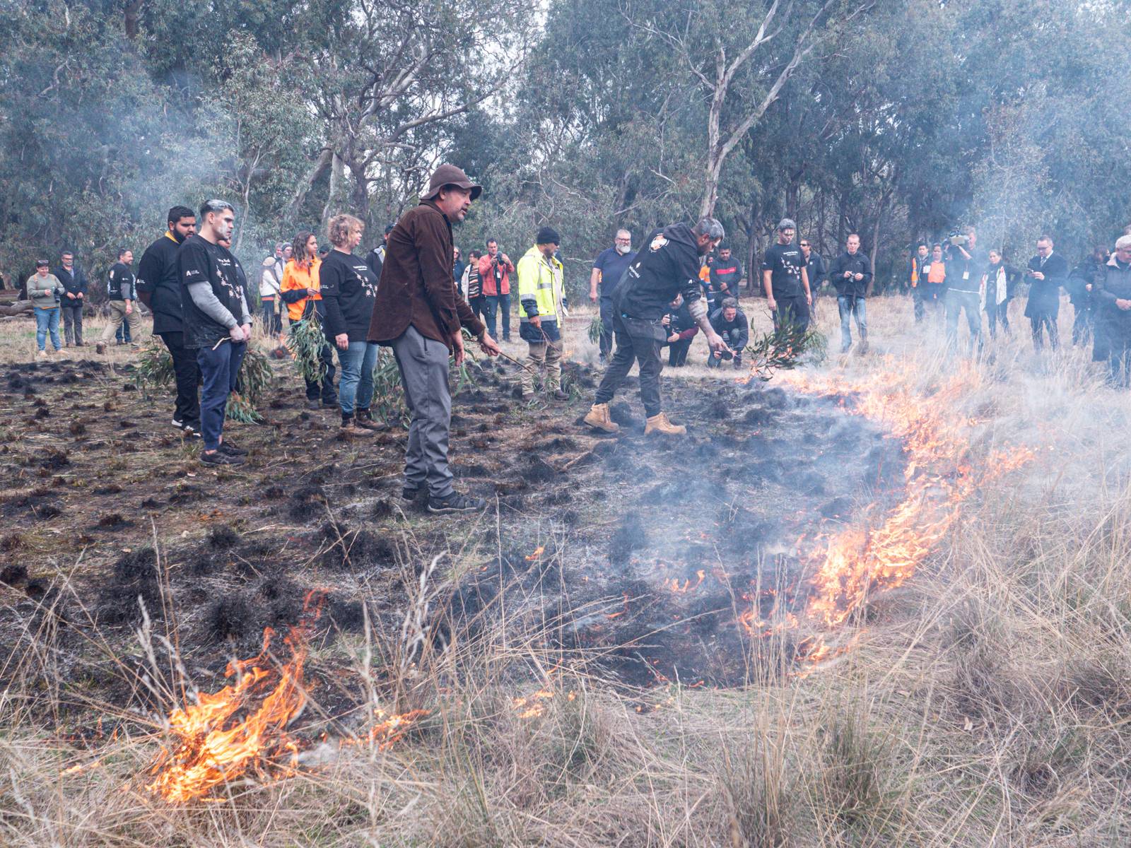 Kaurna people lighting a cultural burn