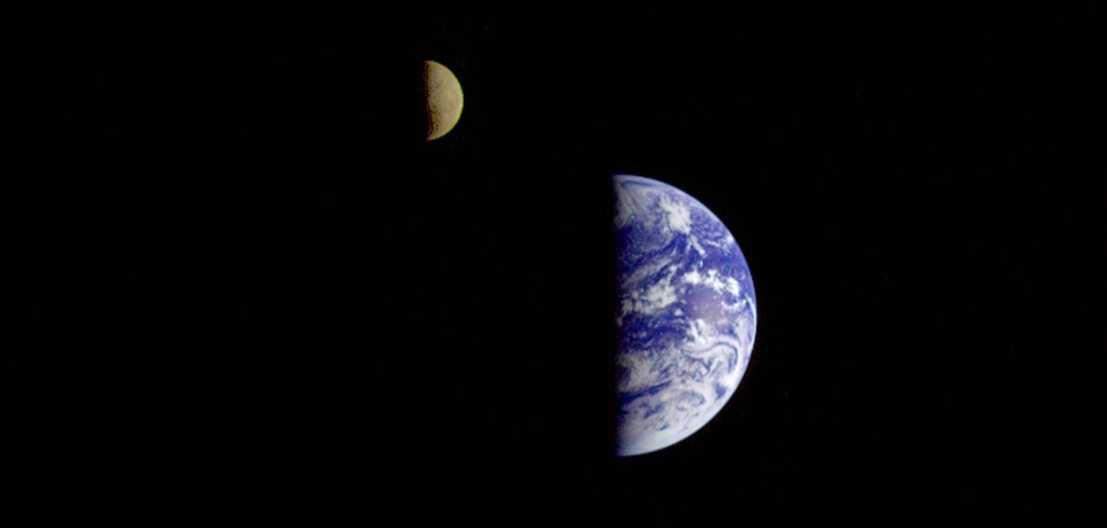 Image of the Earth and the moon from outer space. 
