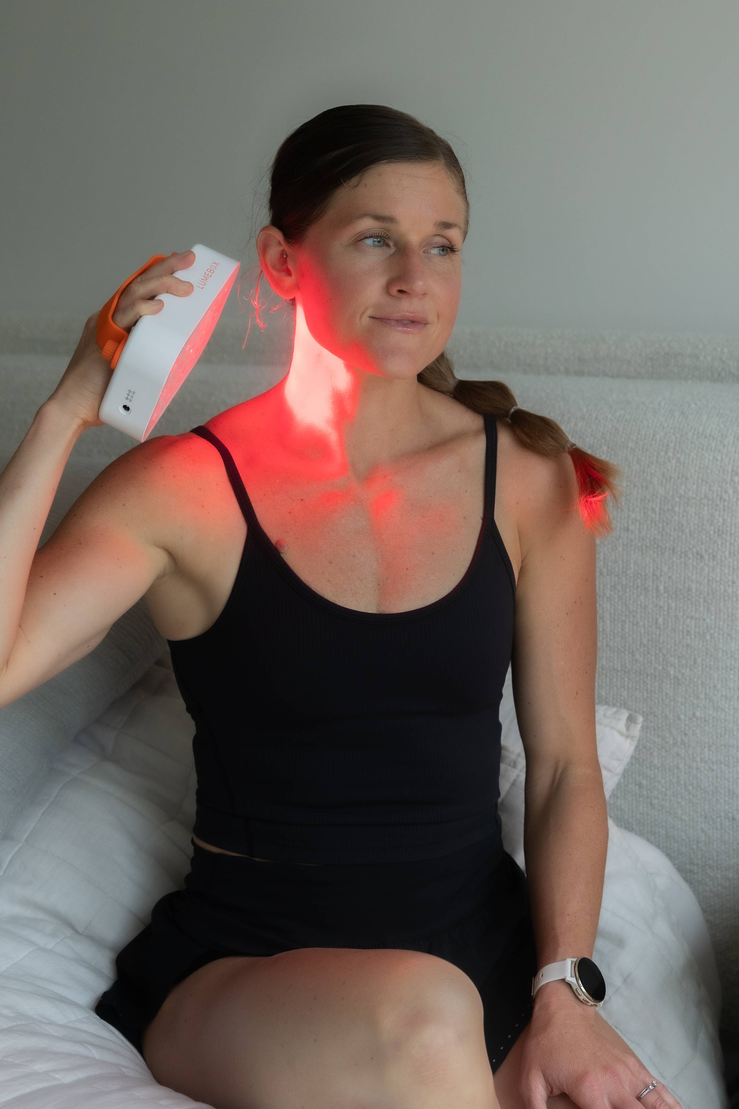 woman using lumebox red light therapy