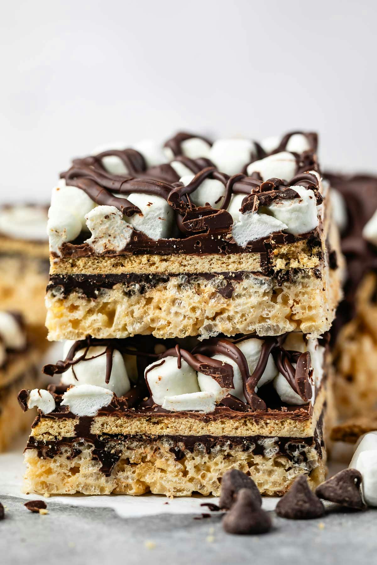 stacked Rice Krispie treats with graham cracker and marshmallows and chocolate on top. 