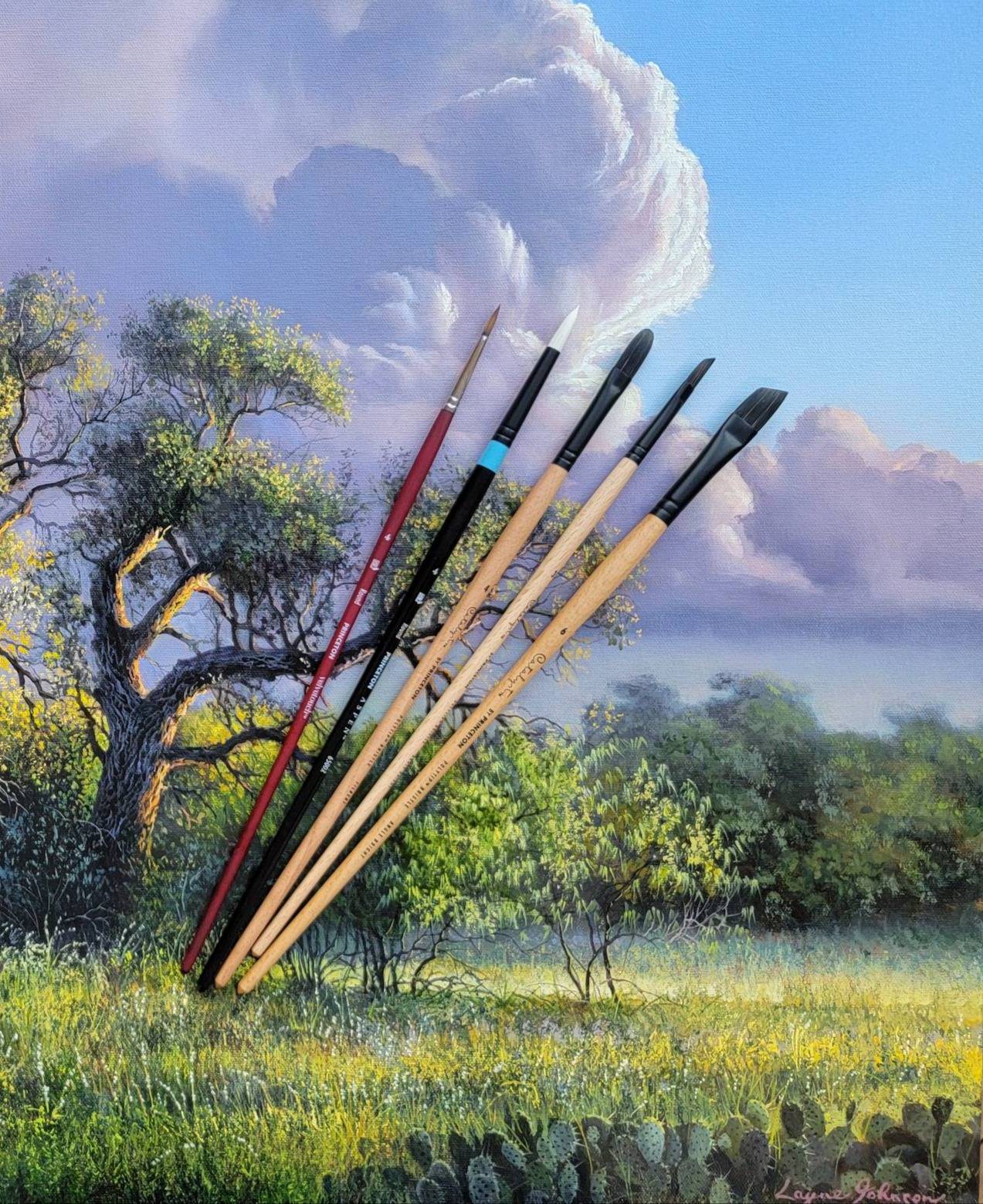 paint brushes laying on painting