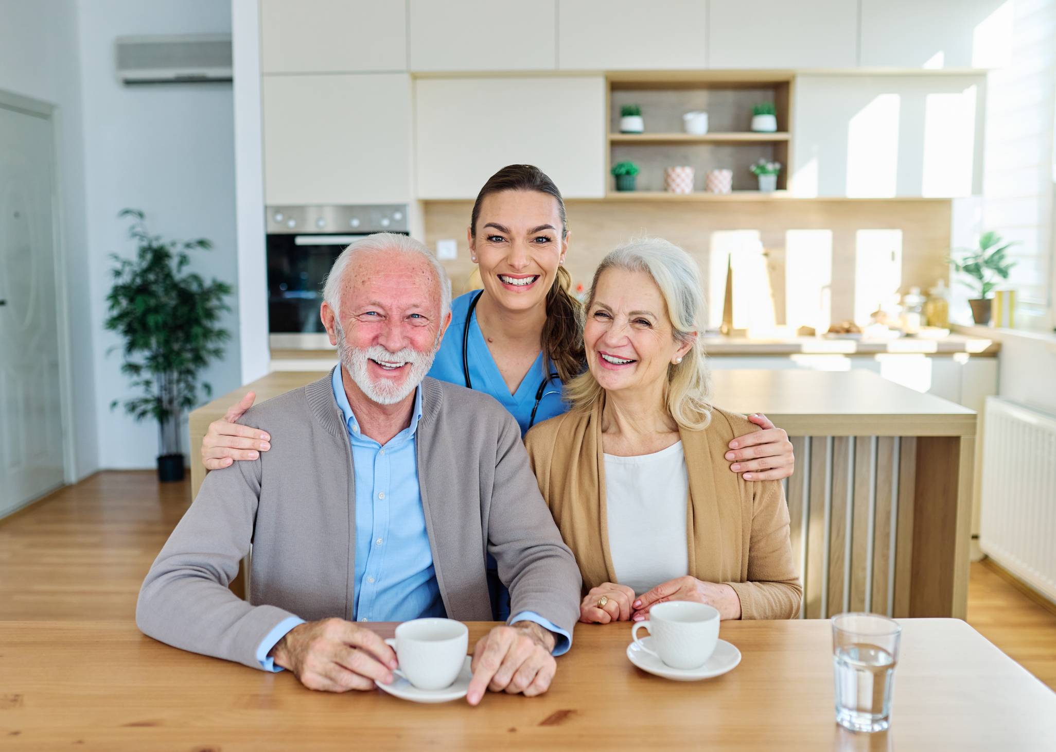 Physician Assistant smiling with older couple
