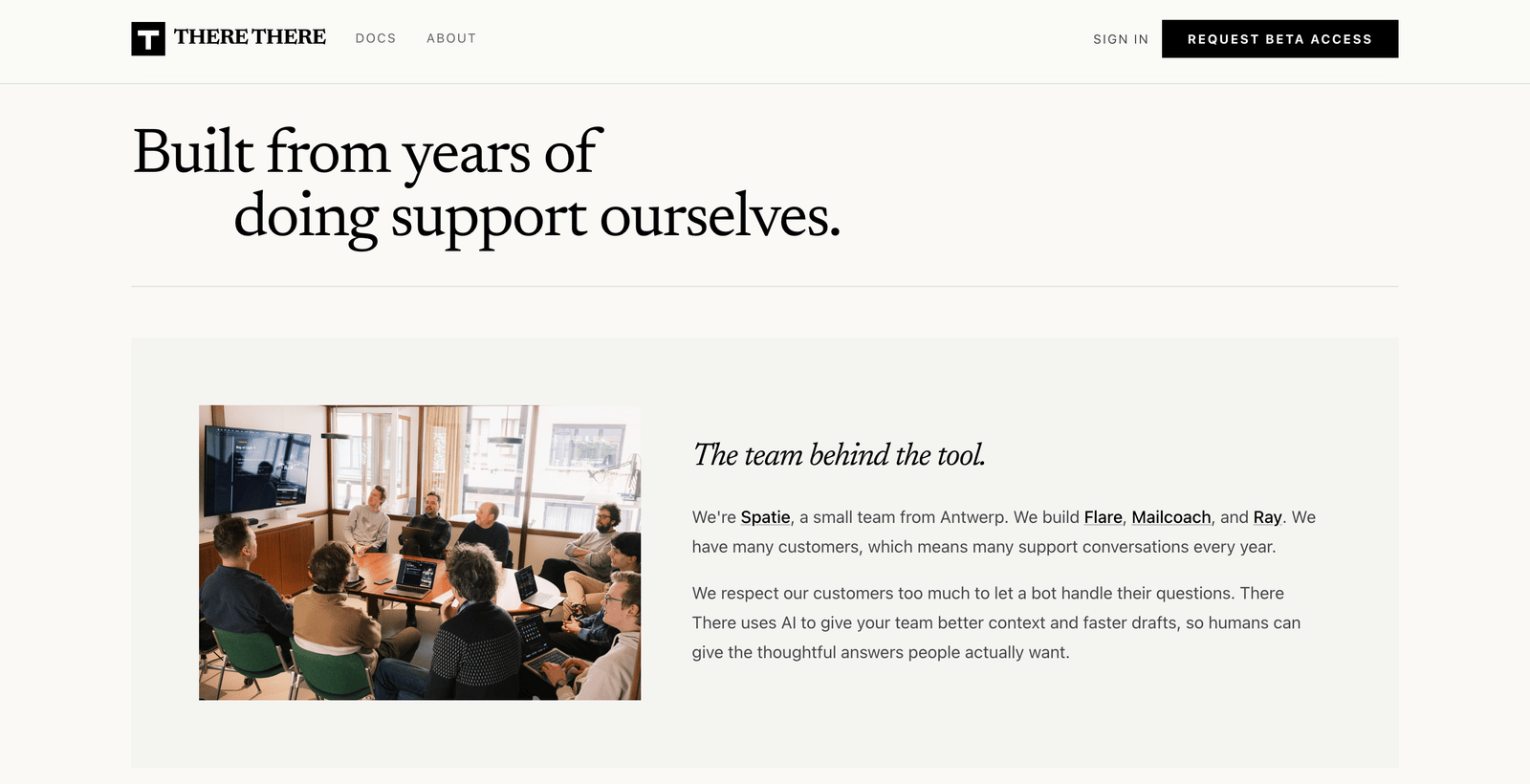 There-There shows a team photo, everyone sitting around a desk