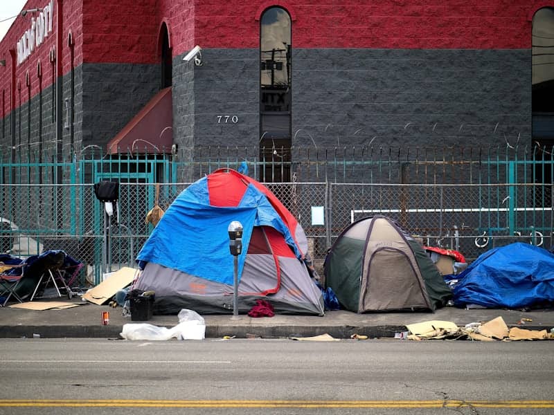 A group of tents sitting on the side of a road