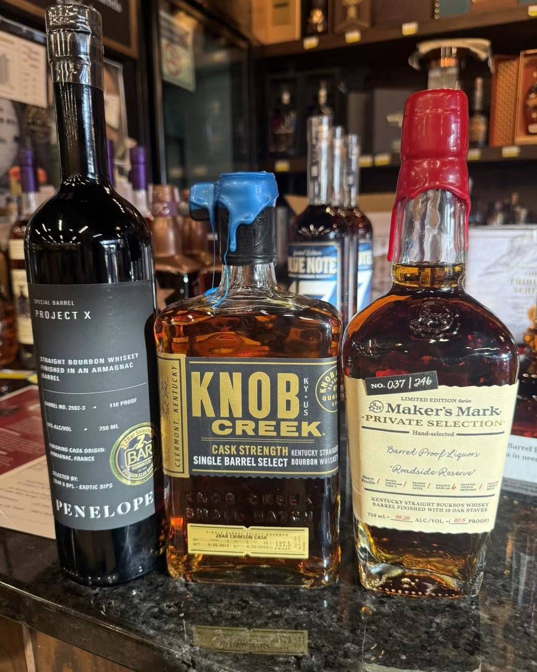 Knob Creek, Penelope X, and Makers Mark Bottles