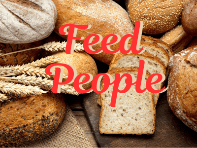 A variety of bread loaves and slices are arranged on a wooden surface. The text "Feed People" is overlaid in red letters.
