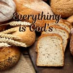 Bread and wheat in a pile with the words "everything is God's" in dark brown