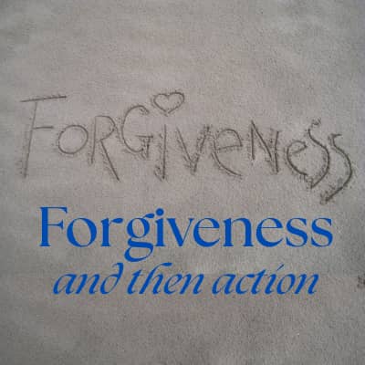 Grey sand with the word Forgiveness written by hand. Then blue words "Forgiveness and then action"