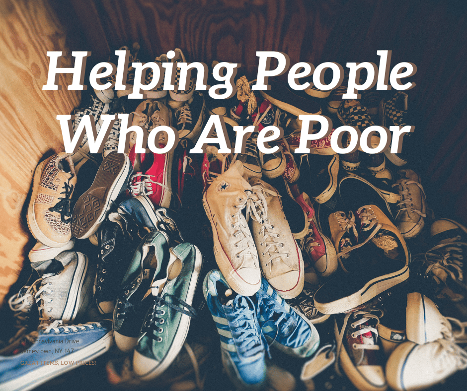 Piles of old shoes with the words "Helping People Who Are Poor"
