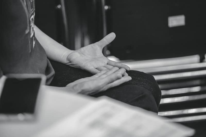 Person gesturing with hands during conversation