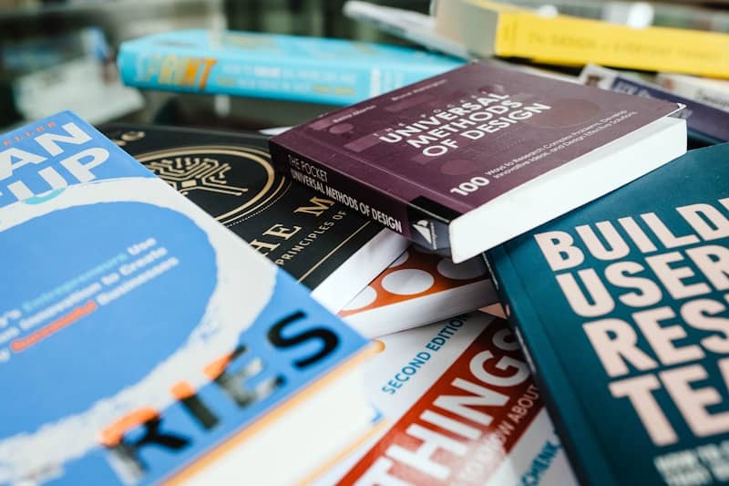 red and blue book on white shelf