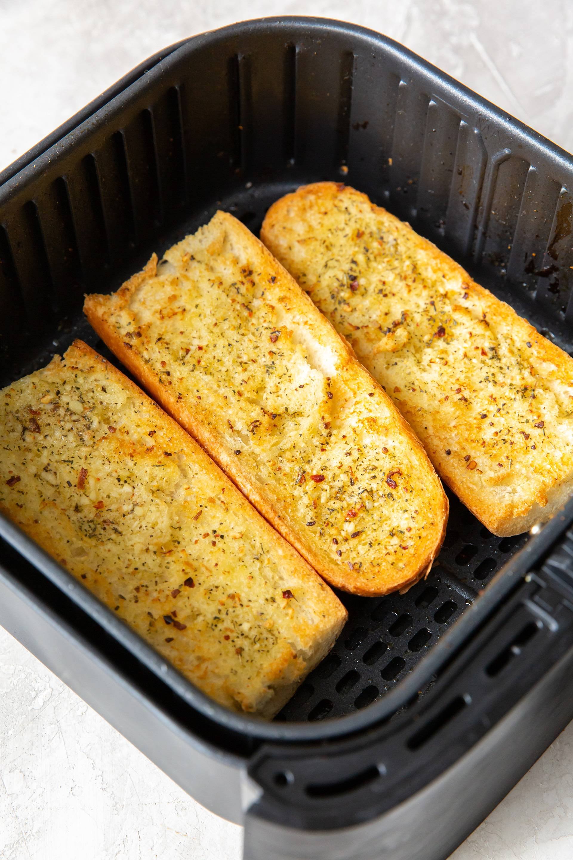 Garlic Bread in an air fryer basket