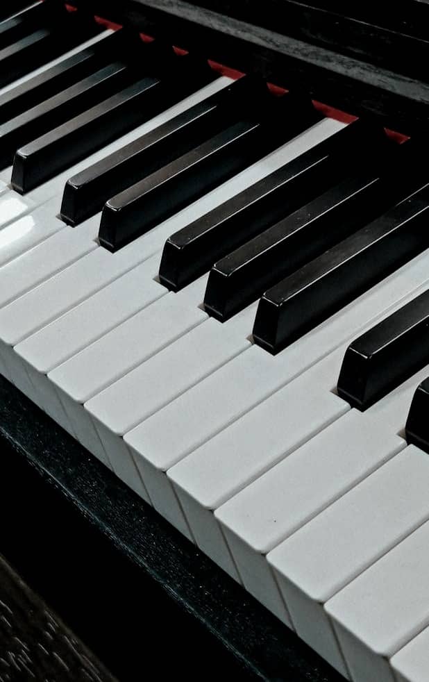 Close-up of a piano keyboard with black and white keys.