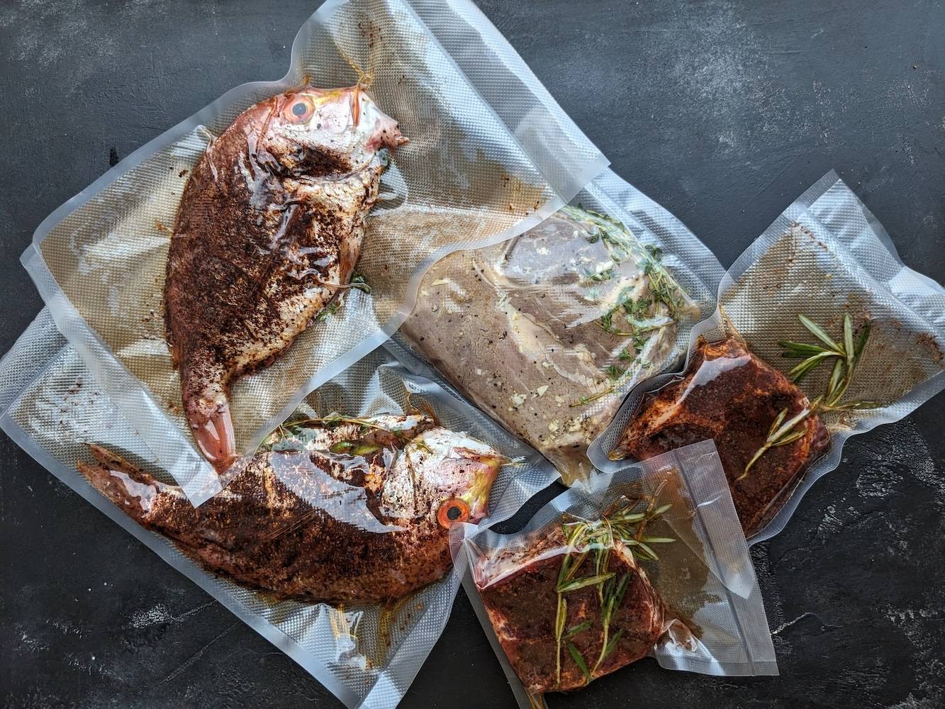 Sous vide steak and fish together
