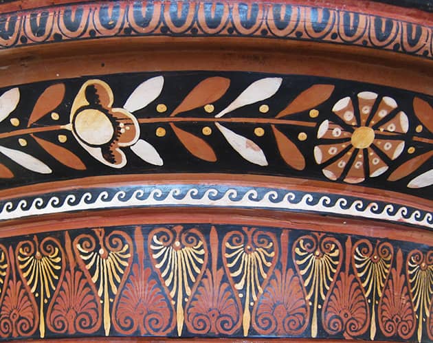A detail of Greek ceramics with a variety of patterns around the rim.