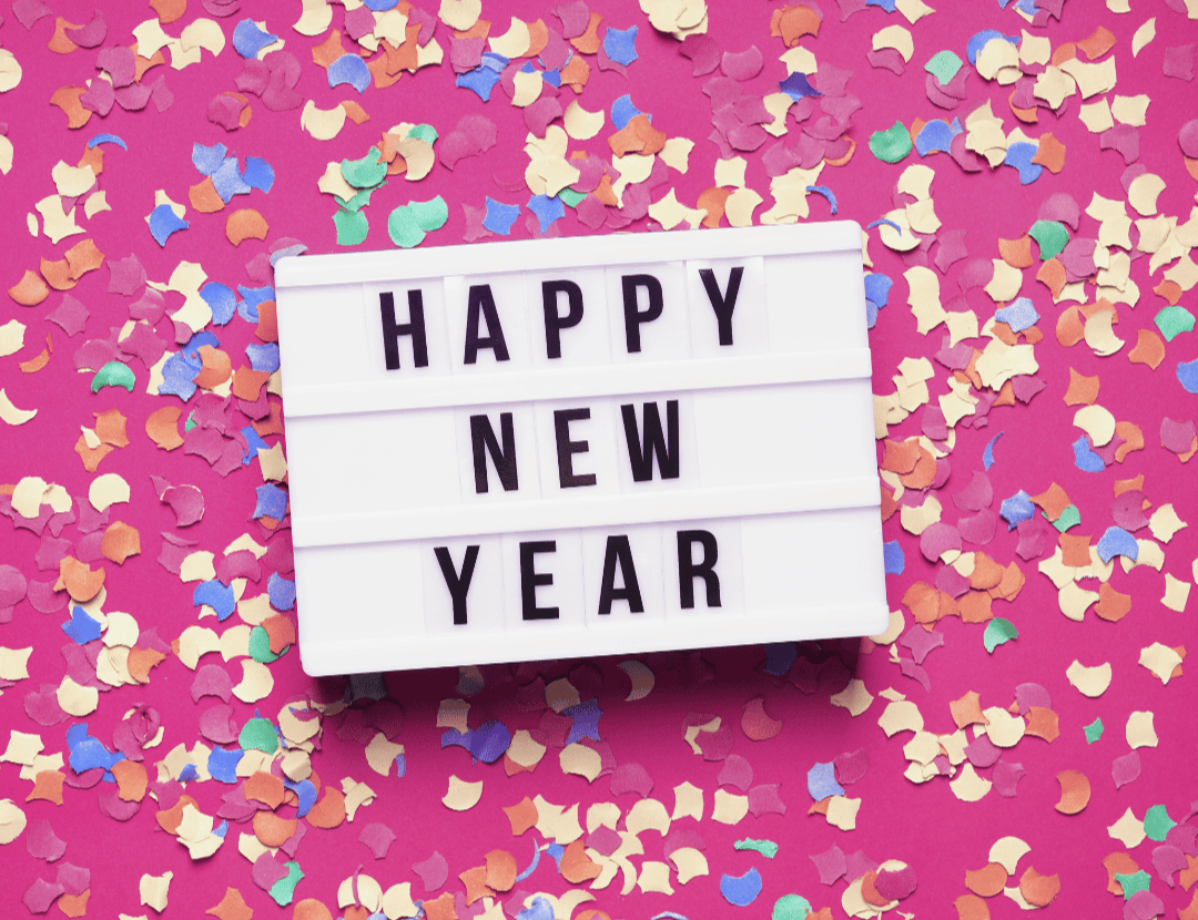 Happy New Year sign with confetti