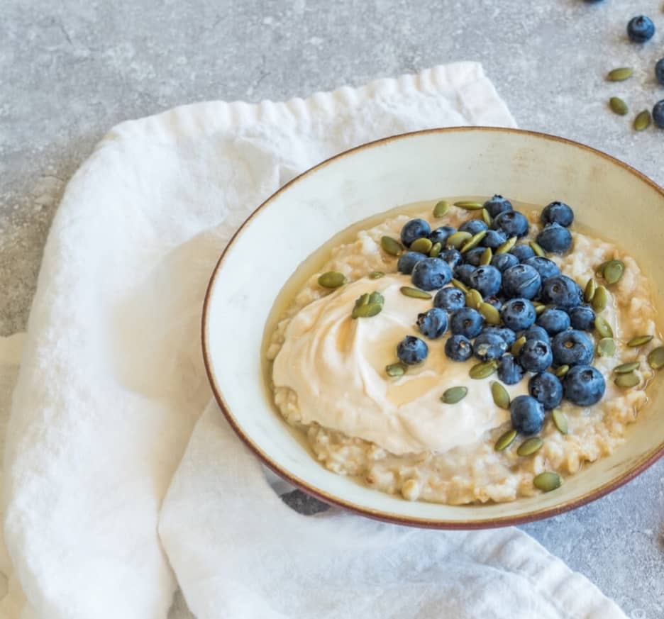 bowl of blueberries, yogurt and hemp seeds