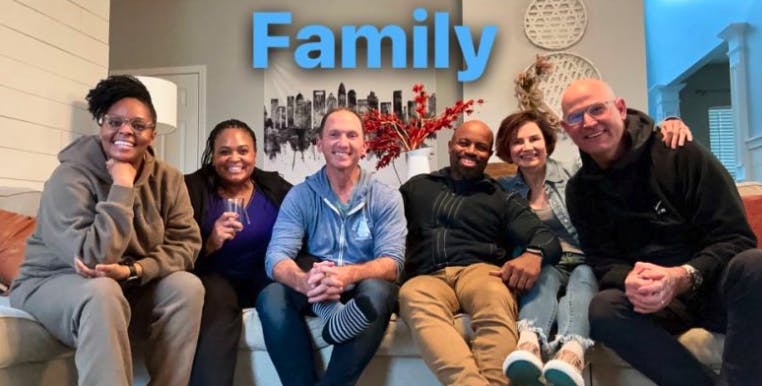 Picture of Marcey sitting with her mastermind "family": Raven, Cynthia, Kevin, Justin, Marcey, and Stan.