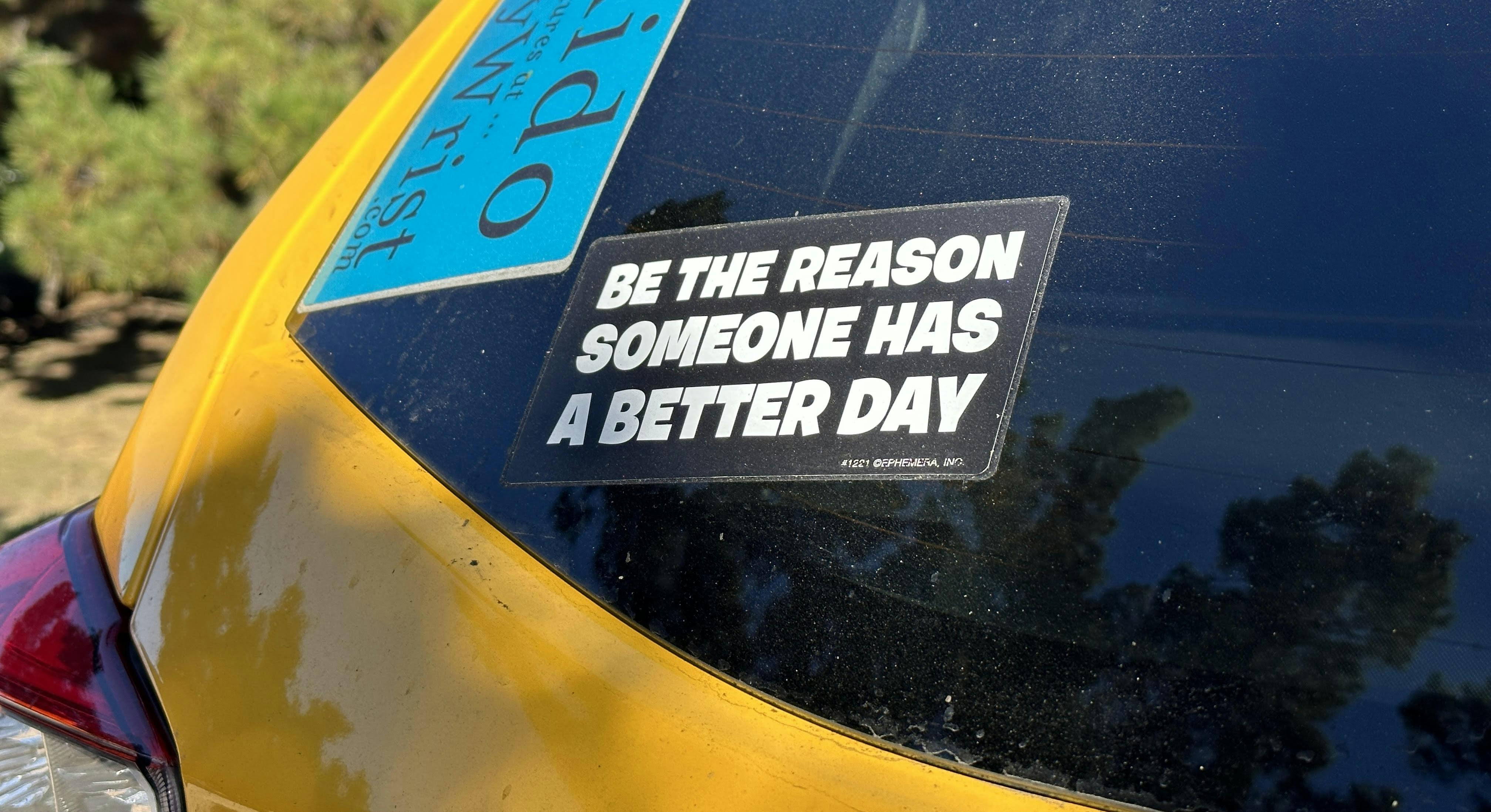 "Be the reason someone has a better day" sticker on The Adventuremobile